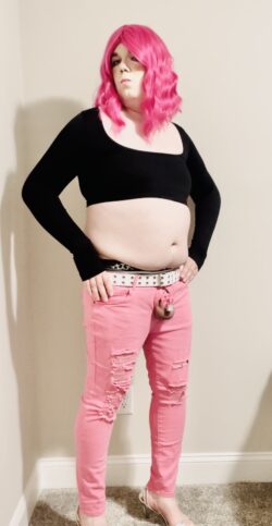 Spread this sissy exposed in pink skinny jeans, black sweater, and panties