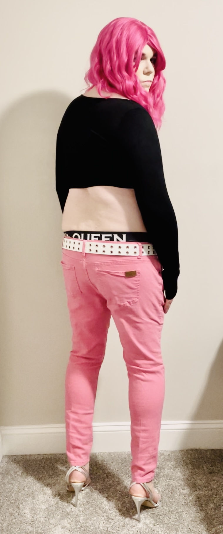 Spread this sissy exposed in pink skinny jeans, black sweater, and panties