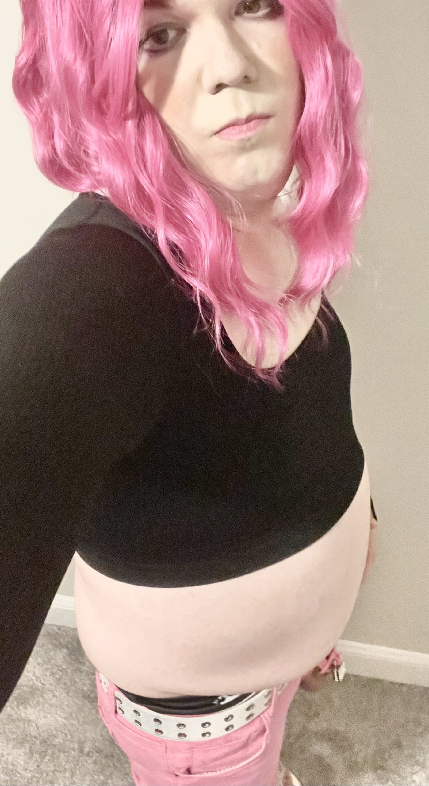 Spread this sissy exposed in pink skinny jeans, black sweater, and panties