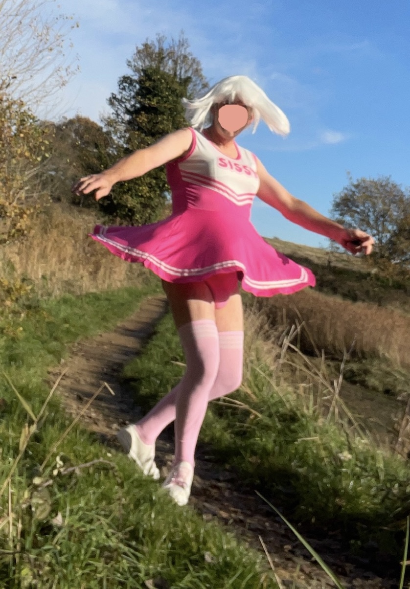 Sissy Annabel outdoors as a cheerleader