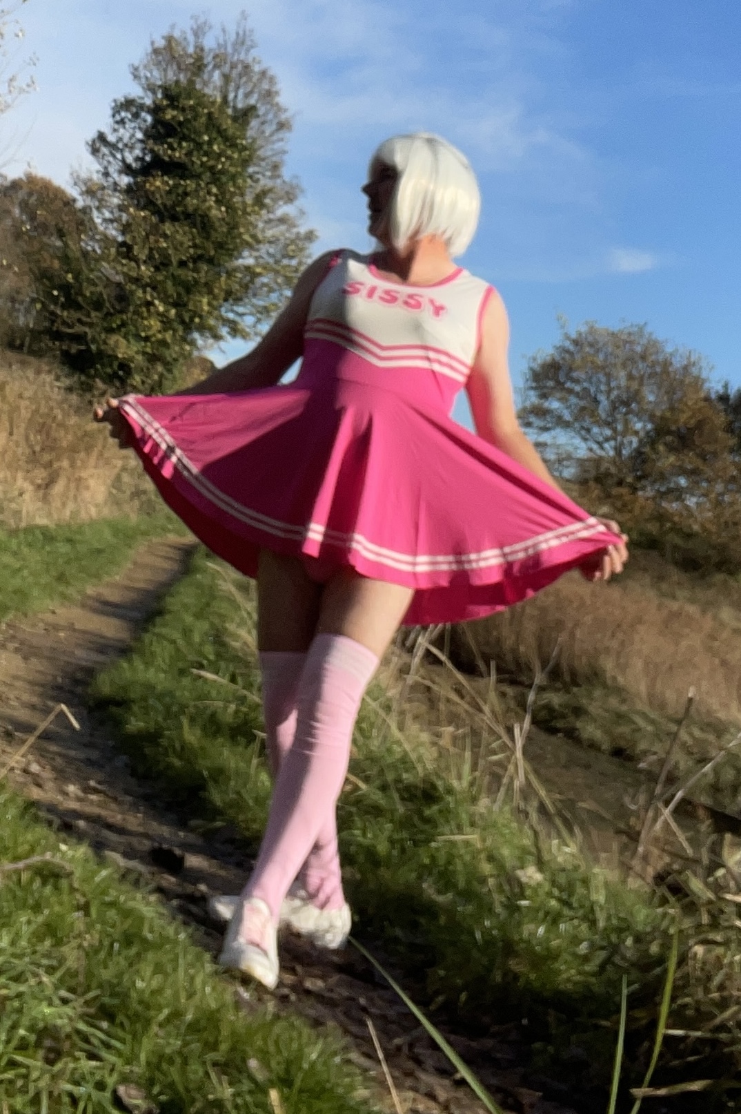 Sissy Annabel outdoors as a cheerleader